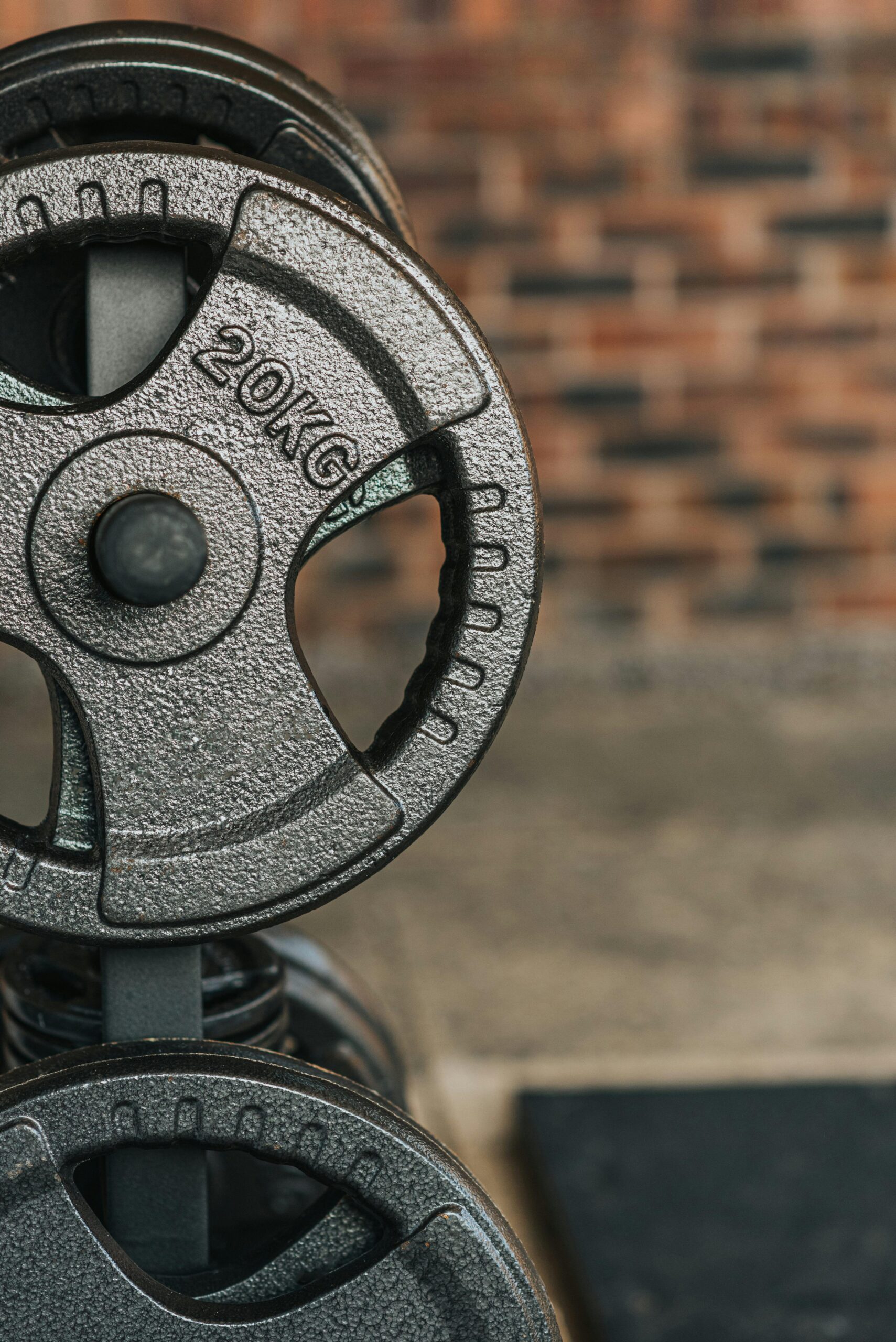 Weight plates in a gym representing science-backed muscle building and strength training